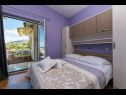 Apartmaji Palmina - comfort apartment: A1 veliki (6),  A2 žuti (4+1), A3 lila (2), SA4 bijeli (2) Makarska - Riviera Makarska  - Apartma -  A2 žuti (4+1): spalnica