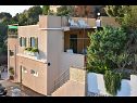 Apartmaji Sretan A1-Rogač(5+1), A2-Višnja(4+1), A3-Kiwi(2+1) Zaliv Ljubljeva (Vinišće) - Riviera Trogir  - Hrvaška  - hiša