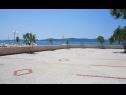 Apartmaji Sor - on the beach: SA1(2+1), A1(4+1), A2(2+2), A3(2+2) Bibinje - Riviera Zadar  - parkirišče (hiša in okolica)